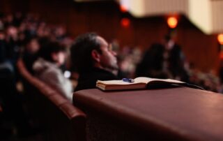 Camera Focused on Open Notebook During Public Hearing