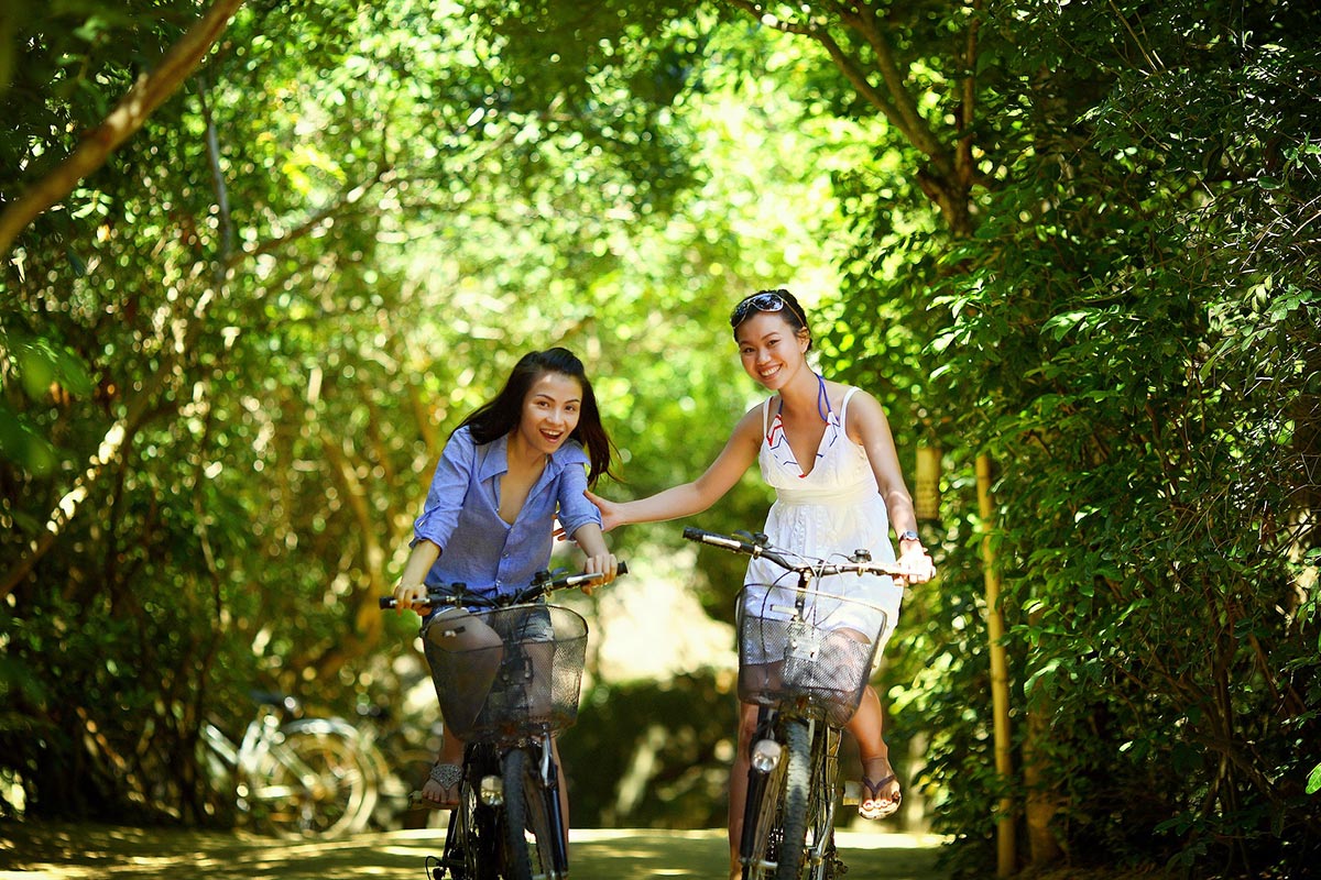 Two Women Riding Bikes
